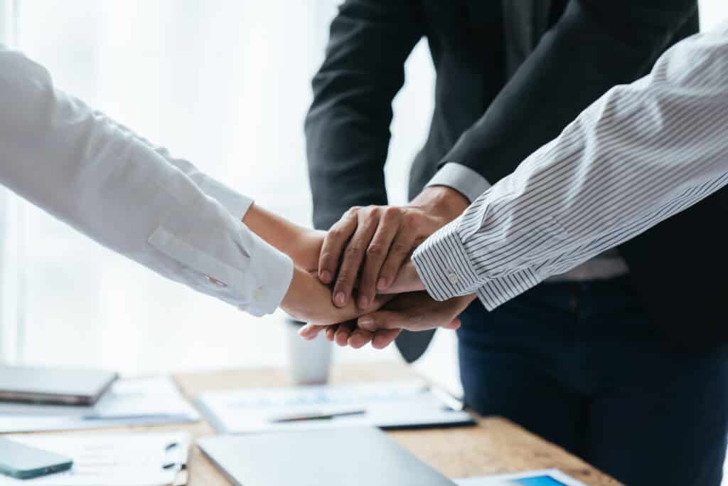 Business people shaking hands, finishing up meeting